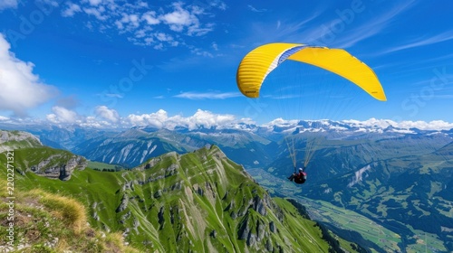 Scenic Paragliding Adventure Over Majestic Green Mountain Landscape Under Bright Blue Sky
