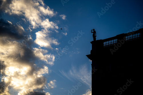 Underexposure of statue on Berlin castle in city center