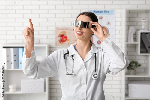 Medical innovation and digital health, doctor using virtual reality glasses f...