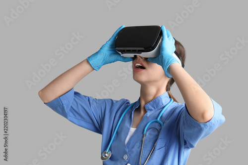 Medical training and virtual reality, doctor using vr headset for surgical si...