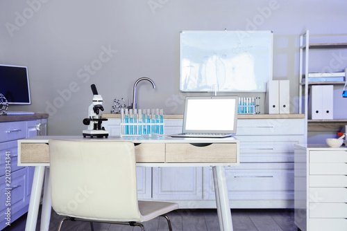 Scientific research and medical innovation laboratory workspace with microsco...