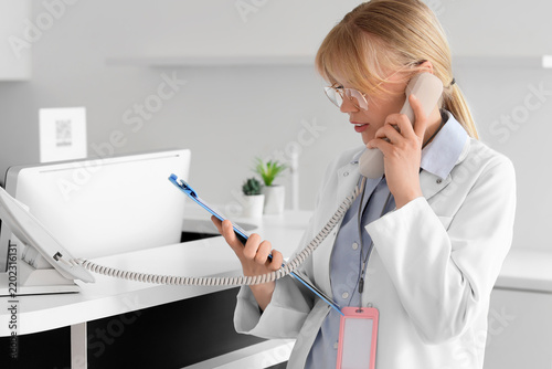 Healthcare administration and patient scheduling, medical receptionist talkin...