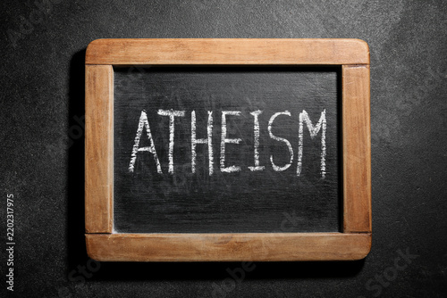 Cuadro en lienzo Atheism and secularism concept, word written in white chalk on a vintage wooden
