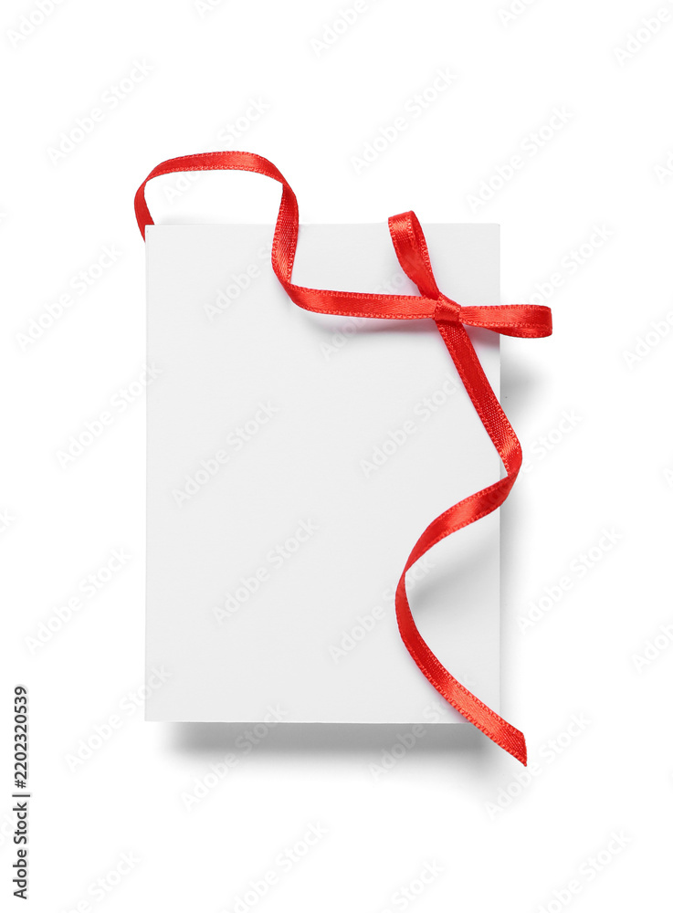Fototapeta premium Blank card with red bow on white background