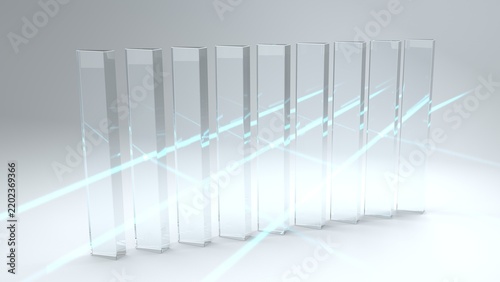 A cyan beam passes diagonally through an array of transparent glass columns