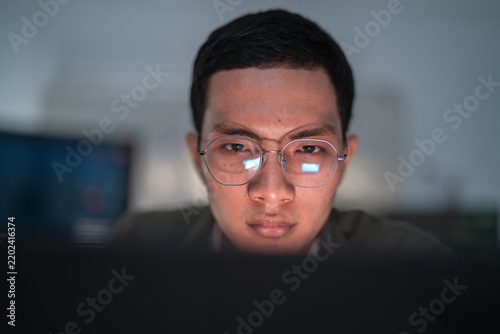 Focused Software Developer Coding Artificial Intelligence At Computer.