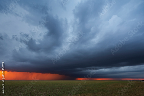 Supercell thunderstorm at Sunset over farmland in burlington colorado