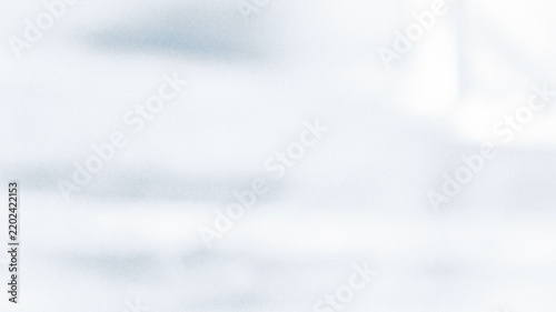 Snow covered ground with blurred winter landscape soft white texture
