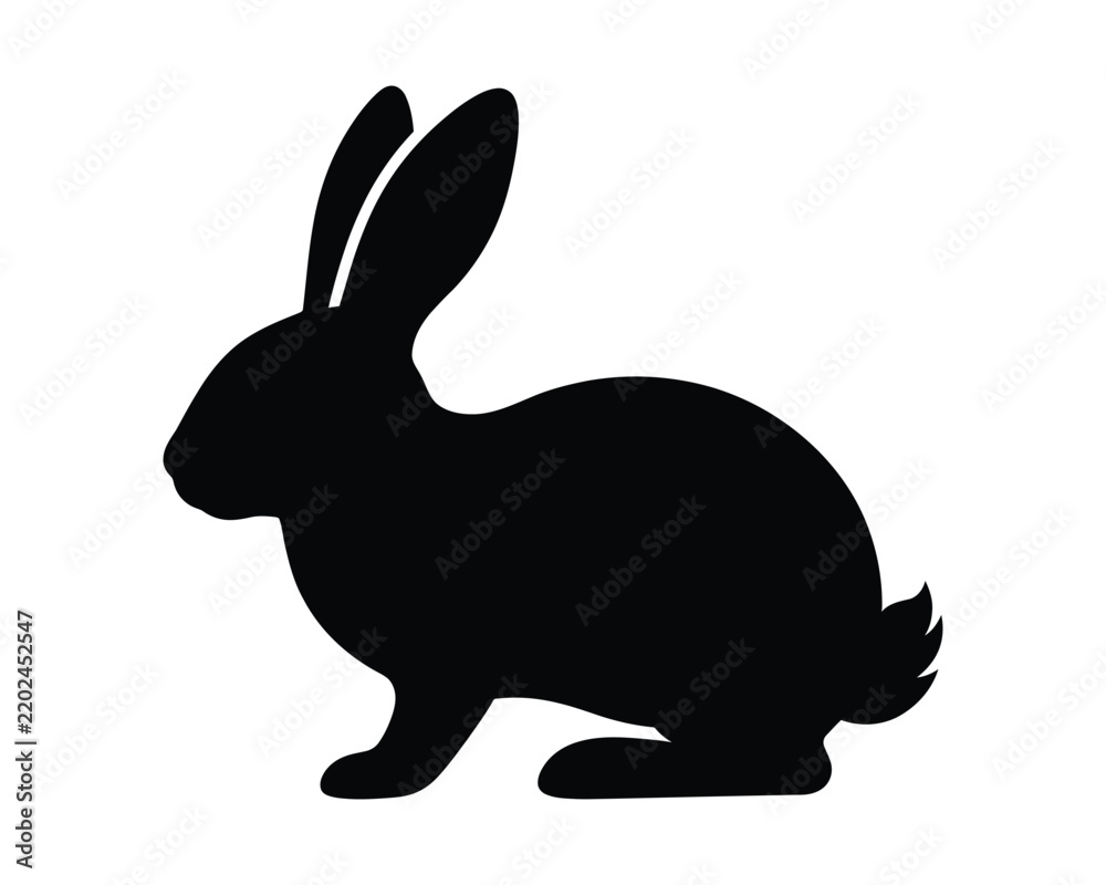 Fototapeta premium A simple black silhouette of a rabbit standing in profile isolated on a plain white background for design