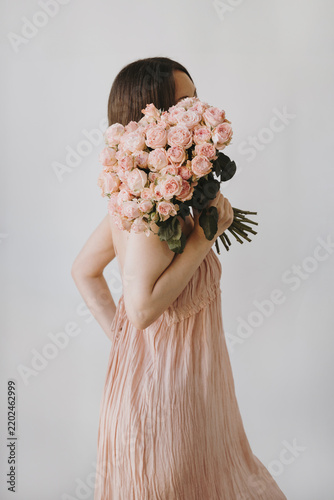 Woman Holding Bouquet of Pink Roses. Social media, banner, or website header design