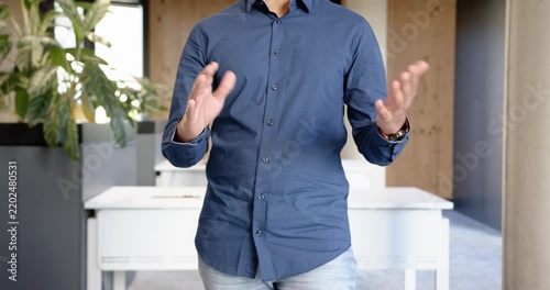 Close up of people talking to the camera, businessman in office gesturing with hands during presenta