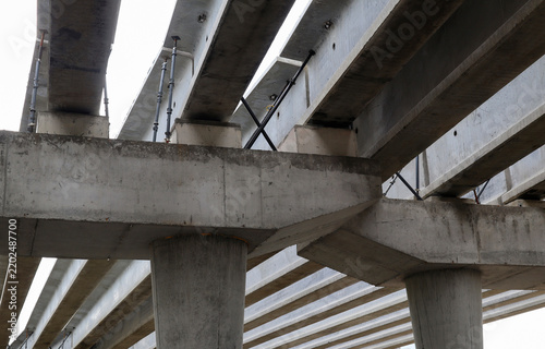 Construction of a two-level road interchange at Satpaev Avenue and Zhibek Zholy Street, with concrete flyovers. Detailed closeup fragment. Industrial concept. Ust-Kamenogorsk (kazakhstan)