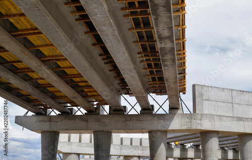 Construction of a two-level road interchange at Satpaev Avenue and Zhibek Zholy Street, with concrete flyovers. Detailed closeup fragment. Industrial concept. Ust-Kamenogorsk (kazakhstan)