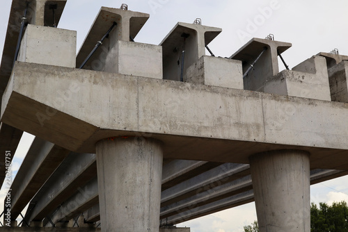 Construction of a two-level road interchange at Satpaev Avenue and Zhibek Zholy Street, with concrete flyovers. Detailed closeup fragment. Industrial concept. Ust-Kamenogorsk (kazakhstan)