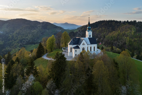 Parish church of st. leonard atop hill with rolling hills in a church