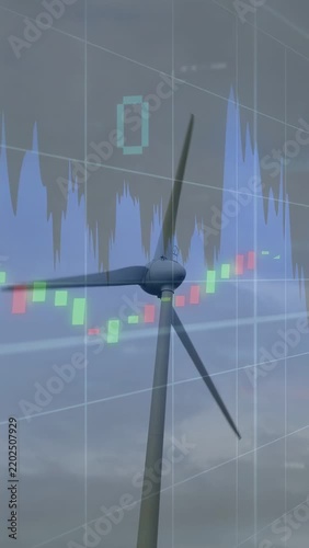 Vertical video: Wind turbine rotating by wind, finance overlay animating to show energy market data