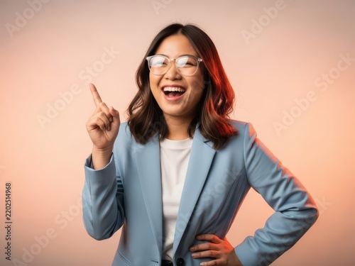Woman smiling confidently pointing finger