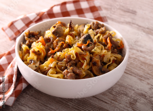 Pasta with mincemeat and mushrooms in  a bowl
