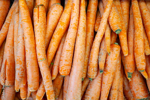 View of fresh orange carrots piled together, showcasing their vibrant color and texture in California City, California, United States.