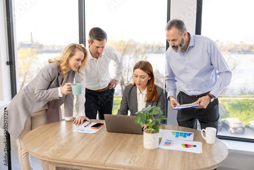 Group of business people working together around office desk