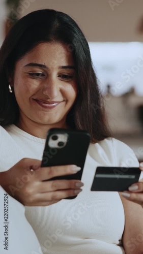 Credit card, phone and smile with woman on sofa for online shopping, digital payment or fintech. Internet banking, account password and customer purchase with person in living room of home for order