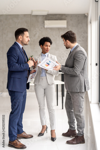 Diverse business team with African American woman collaborating in office