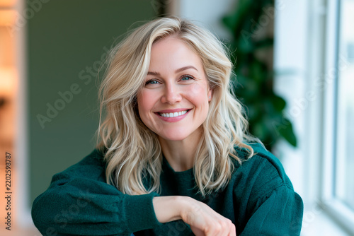 Confident Female Corporate Coach Standing by Window in Modern Green Workspace