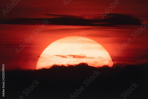 a red sunset with clouds