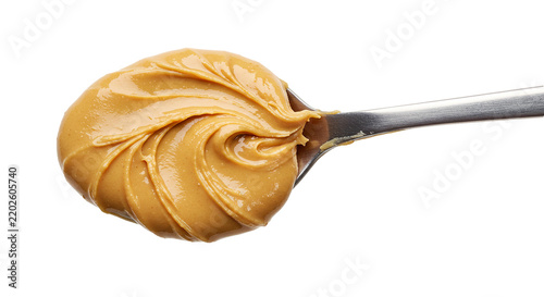 Creamy peanut butter on silver spoon isolated on transparent background for food recipes.