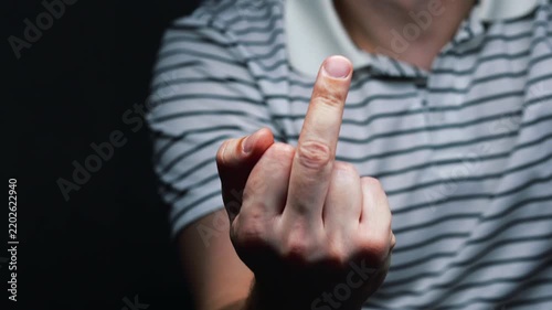 Close-up of a middle finger.
