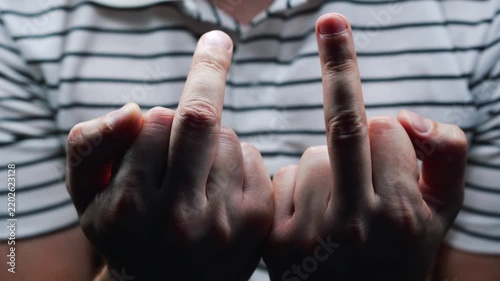 Close-up of a middle finger.
