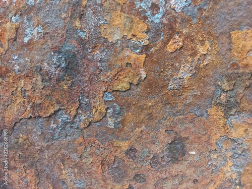 Rusted Metal Surface with Flaking Paint and Corrosion Texture.