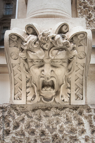 Close-up of a faun's face. Building decoration in Vienna, Austria