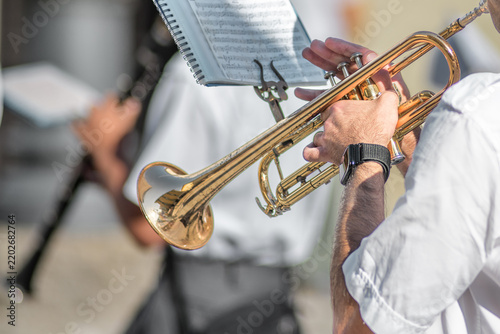 Close-up of Trumpet Player Performing with Outdoor Band