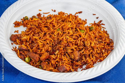 Fried Rice With Meat And Peas On Plate