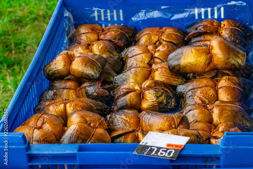 Smoked Fish Tied With String In Blue Crate