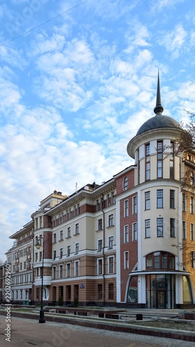 Фотография Beautiful classical european building facade with a corner tower and spire again