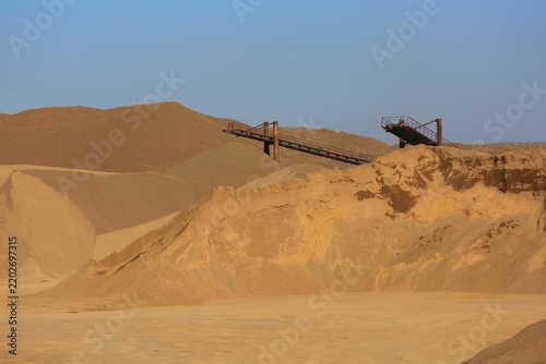 Sand quarry: sand extraction, processing, and shipment.