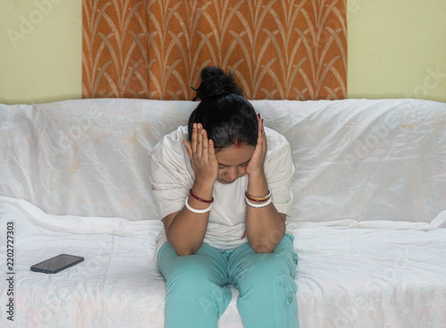 Cuadro en lienzo Indian young woman feel stressed suffer from migraine or headache at home