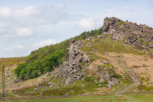 Fotografie Rock climbers and walkers on the gritstone crag of Hen Cloud near The Roaches un