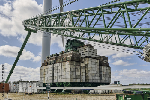 Thisted, Denmark - 11 August 2026: View of the massive 3000-ton counterweight of the electric ring crane at the National Test Center for Large Wind Turbines in Osterild under a cloudy sky.
