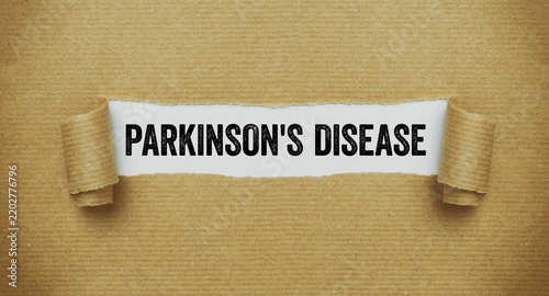 Konstfotografi Torn paper revealing the word Parkinson's disease