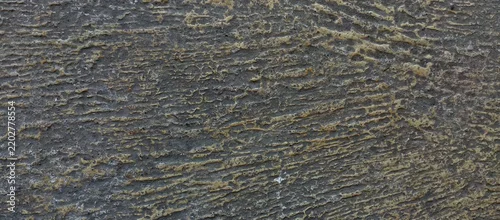 Panel kuchenny z motywem Close-up view of a rough, grey cement floor surface featuring deep, brushed horizontal grooves and scratches. This abstract, industrial-style concrete texture is perfect for grunge backgrounds