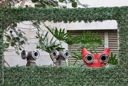 Tropical garden decoration in the form of a bird and binoculars