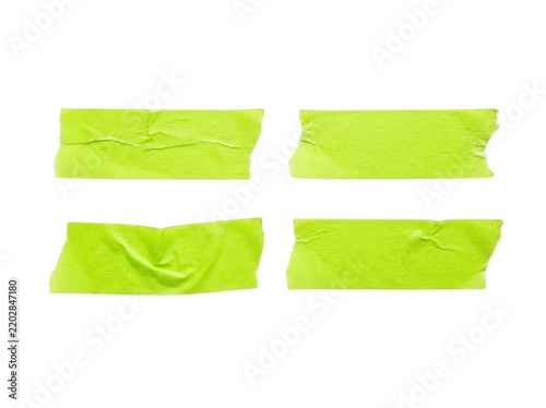 Four rectangular pieces of wrinkled lime green masking tape
