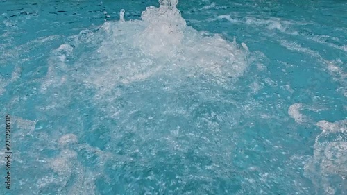 hydromassage in a swimming pool with blue water