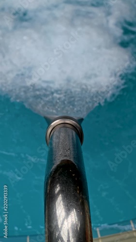 A close up of a hose in a pool, great for water and pool related images