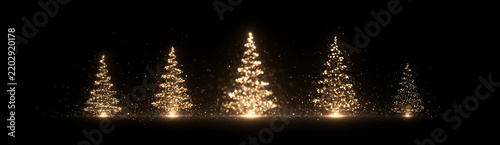 Golden Christmas trees made of glowing glitter and sparkling particles on black background. Panoramic holiday banner for New Year and festive celebrations.