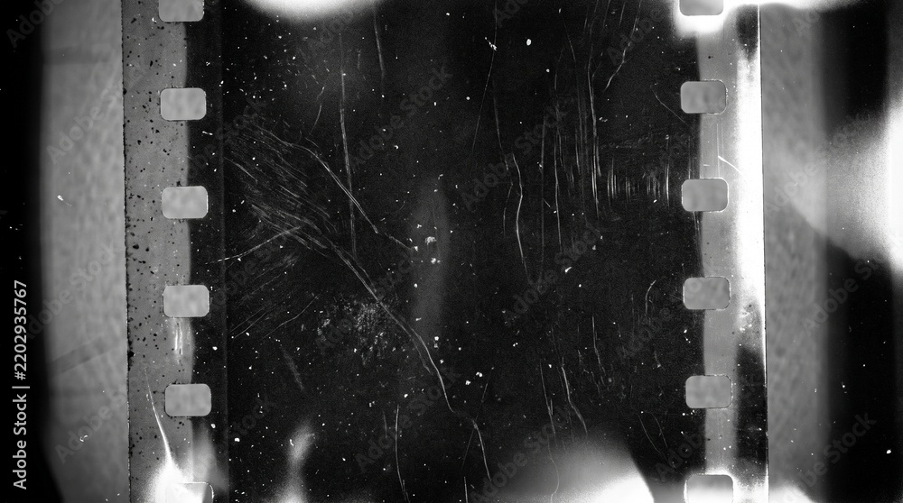Fototapeta premium Old film texture with scratches, noise and light leaks. Realistic transparent overlay film texture in black-white, dust and grain. Distressed retro movie or photo negative effect of cinema nostalgia
