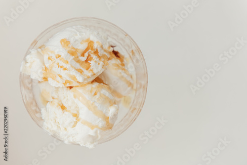 Картината върху платно Ice cream served in a cup with creamy texture and topping